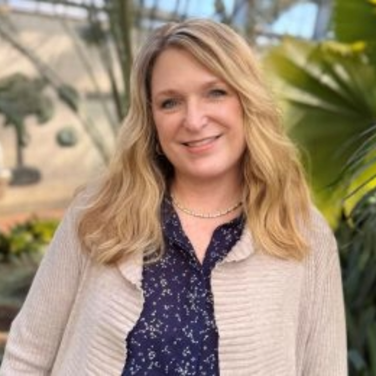 Janet Haas, Clinical EFT Practitioner and nervous system regulation expert in Charlotte, NC, smiling for Rising Feminine EFT